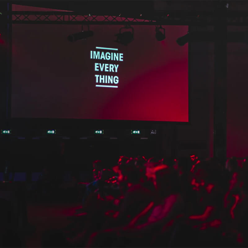 Event hall with a large banner that reads imagine everything