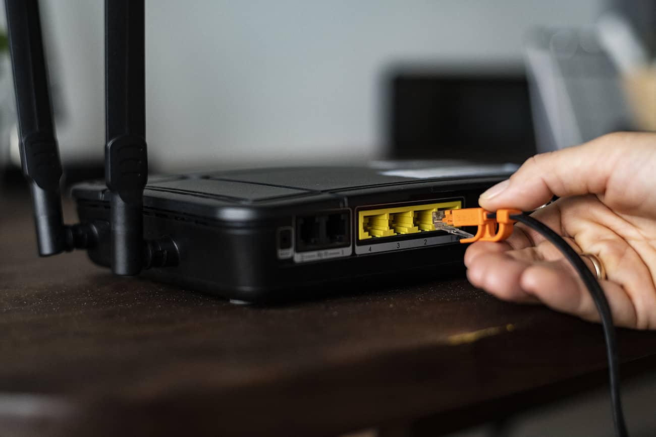 plugging ethernet cable into router