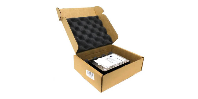 A cardboard box with foam lining for shipping hard drives